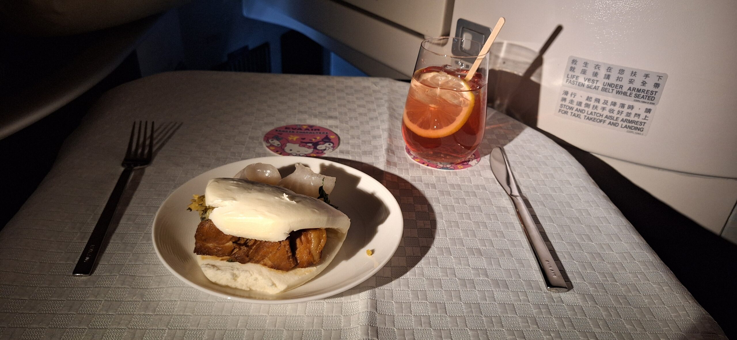 EVA Air Business Class a plate of food and a drink on a table