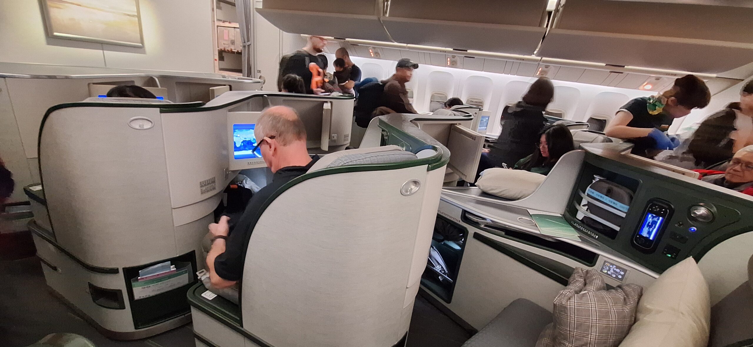 EVA Air Business Class people sitting in an airplane