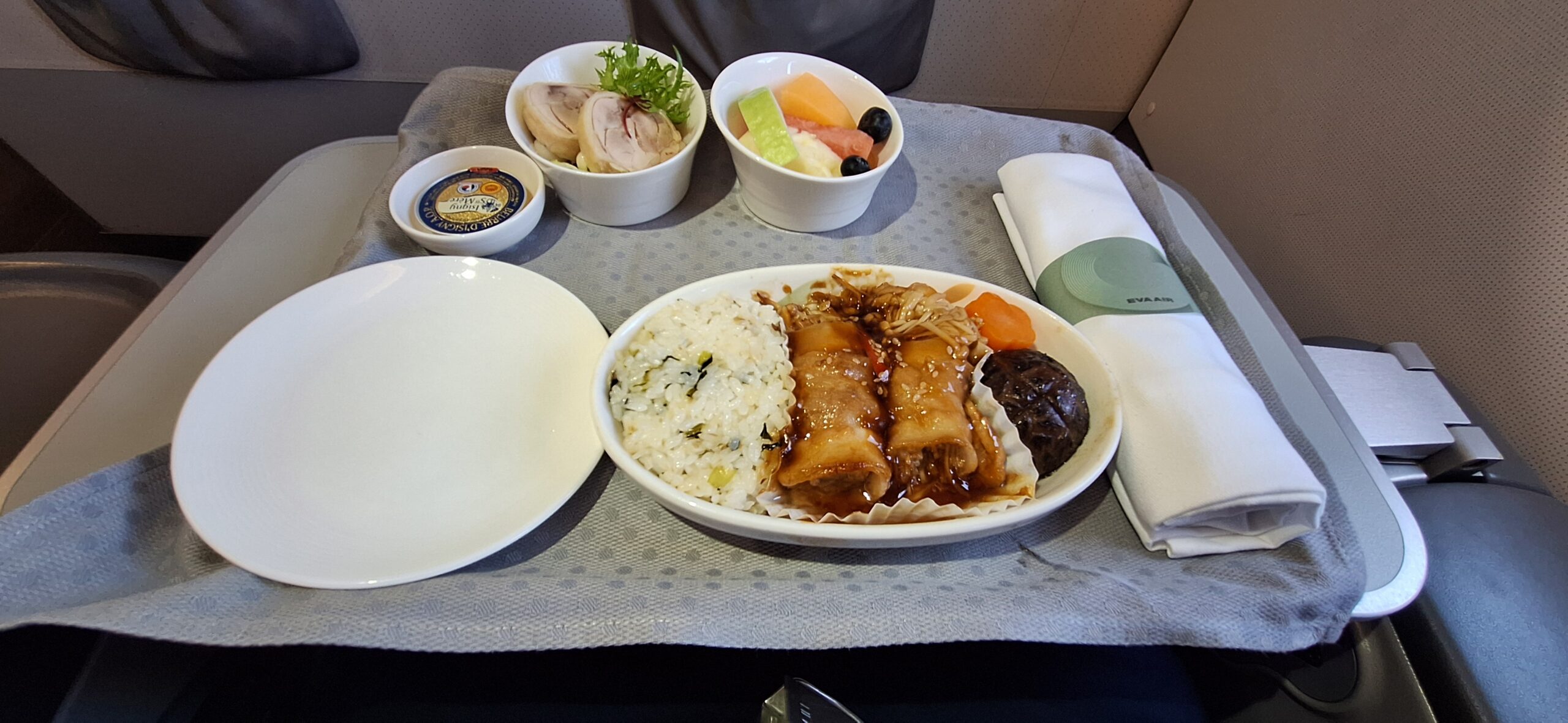 EVA Air Business Class a plate of food on a table