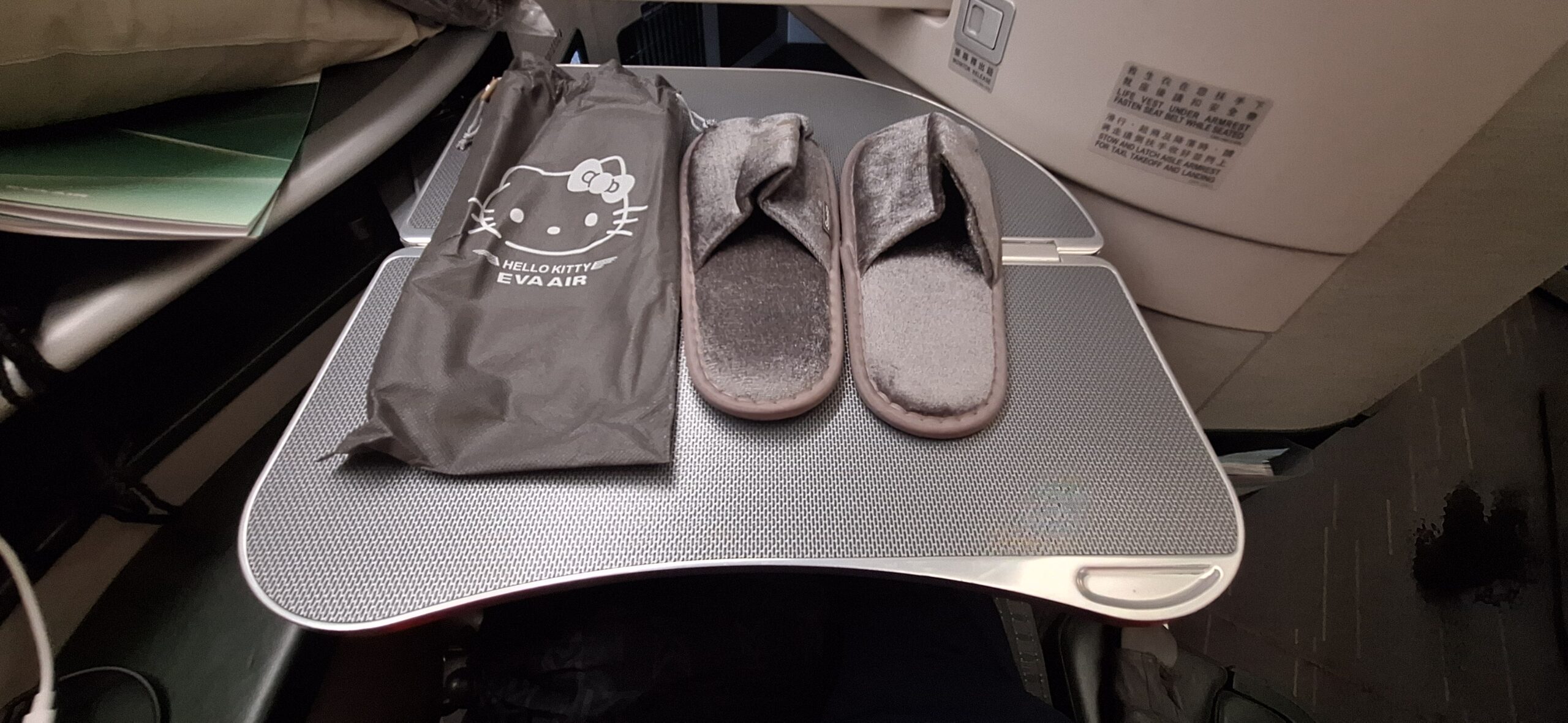 EVA Air Business Class slippers on a table