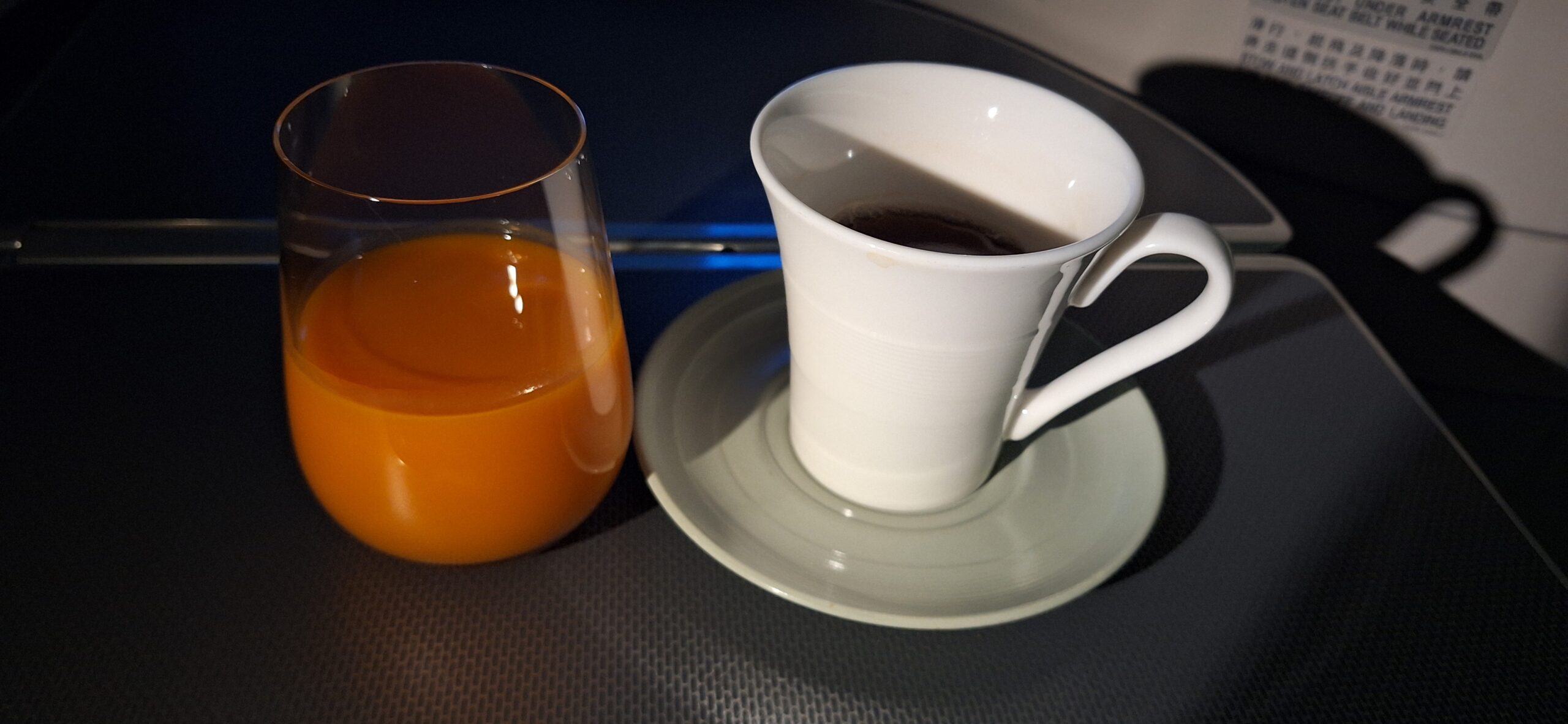 EVA Air Business Class a cup of coffee and a glass of orange juice