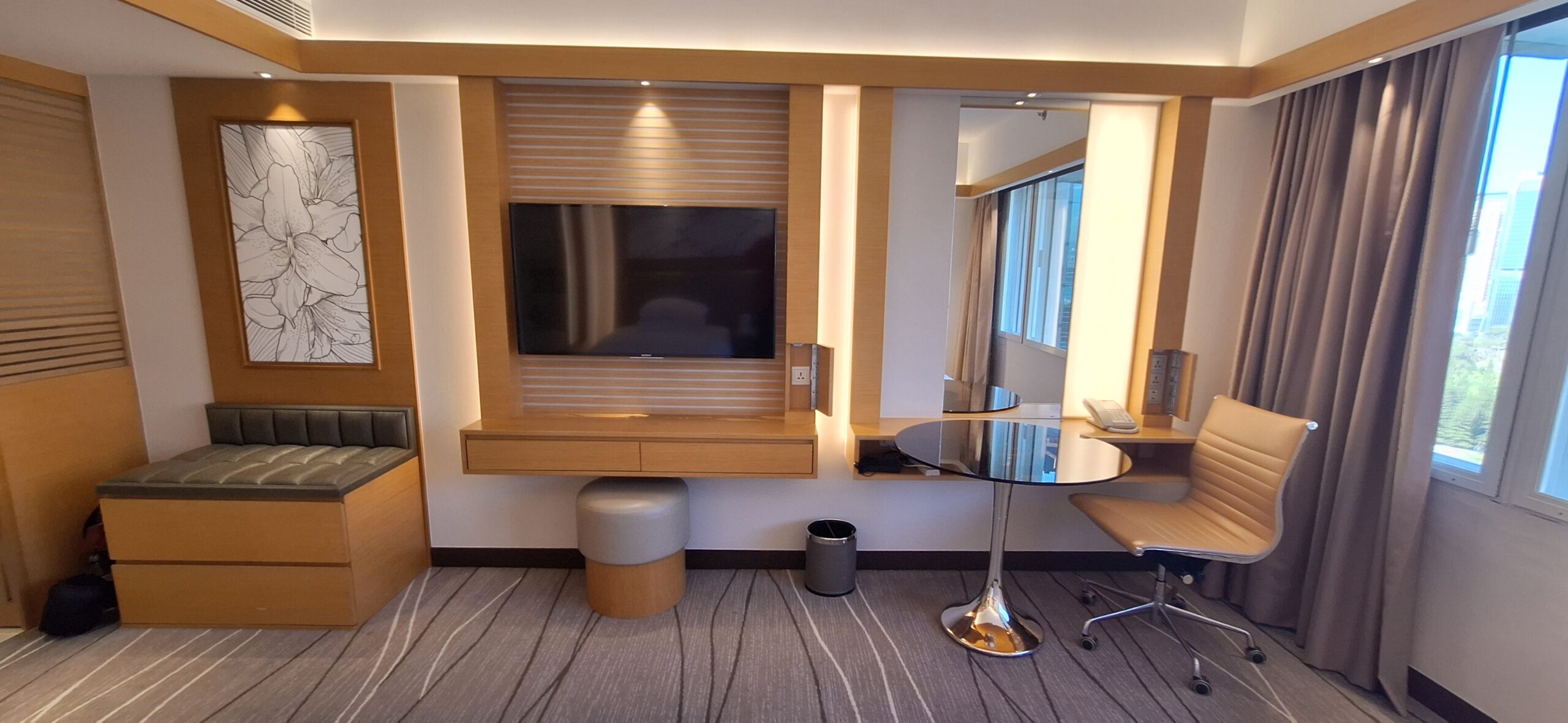 The Park Lane Hong Kong Review a room with a television and a mirror