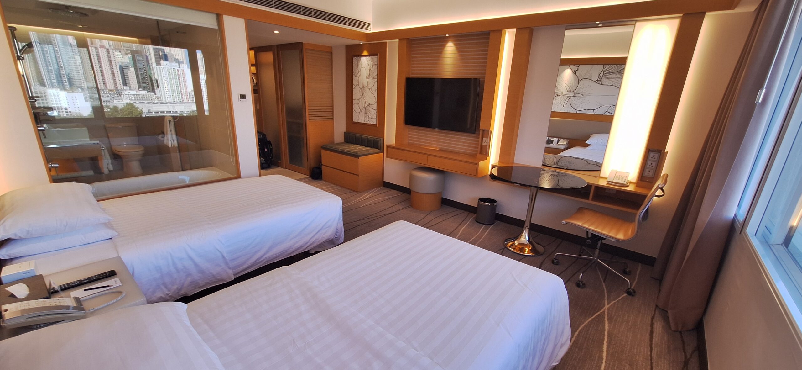 The Park Lane Hong Kong Review a room with two beds and a television
