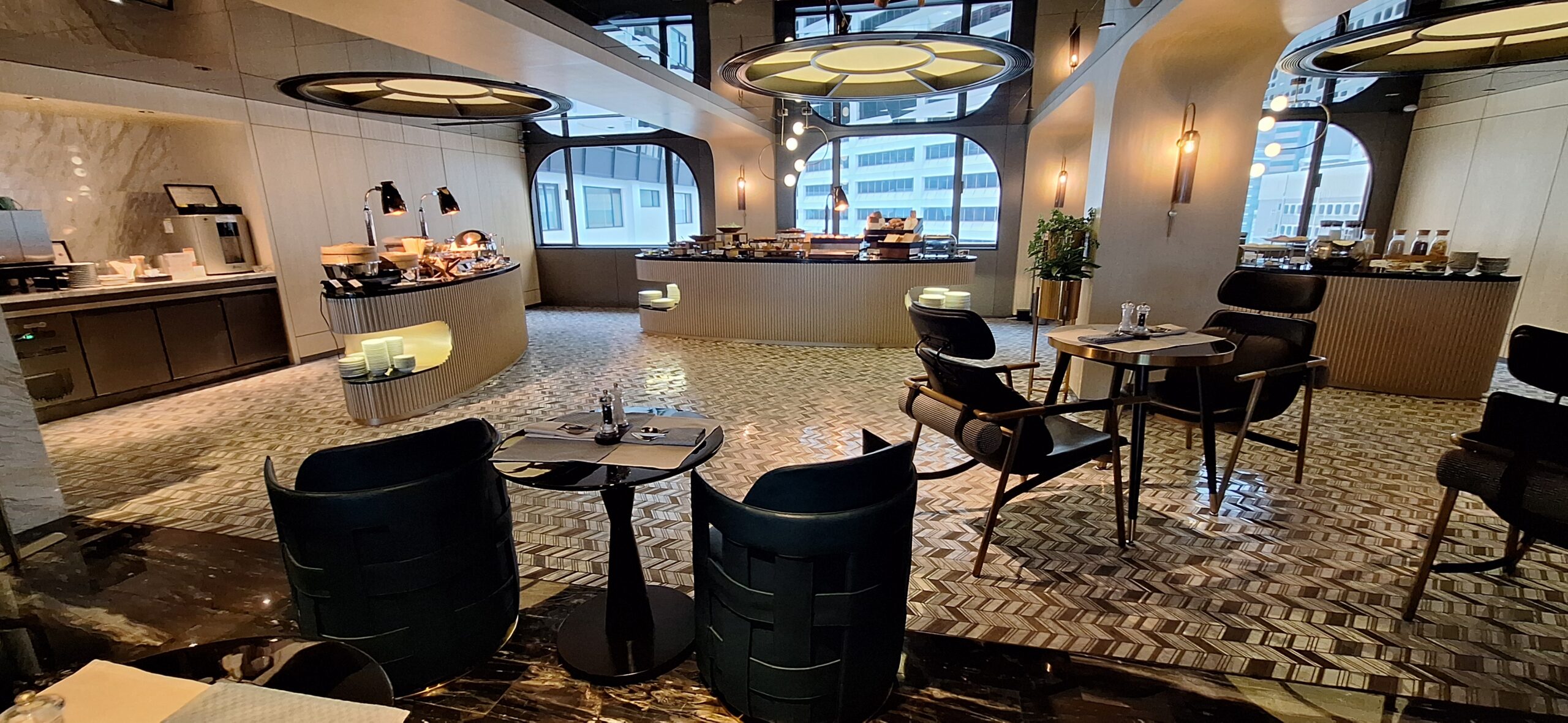The Park Lane Hong Kong Review a room with tables and chairs