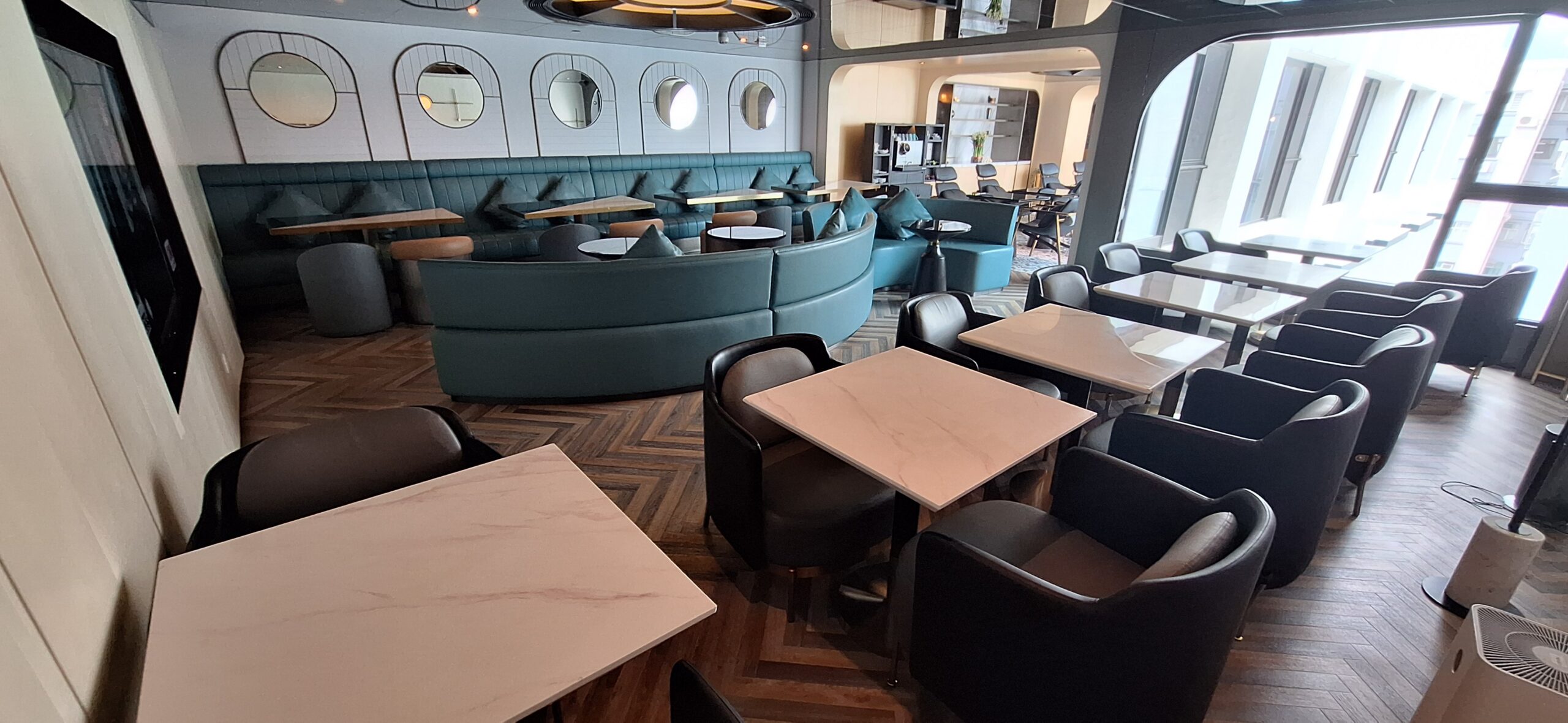 The Park Lane Hong Kong Review a room with tables and chairs