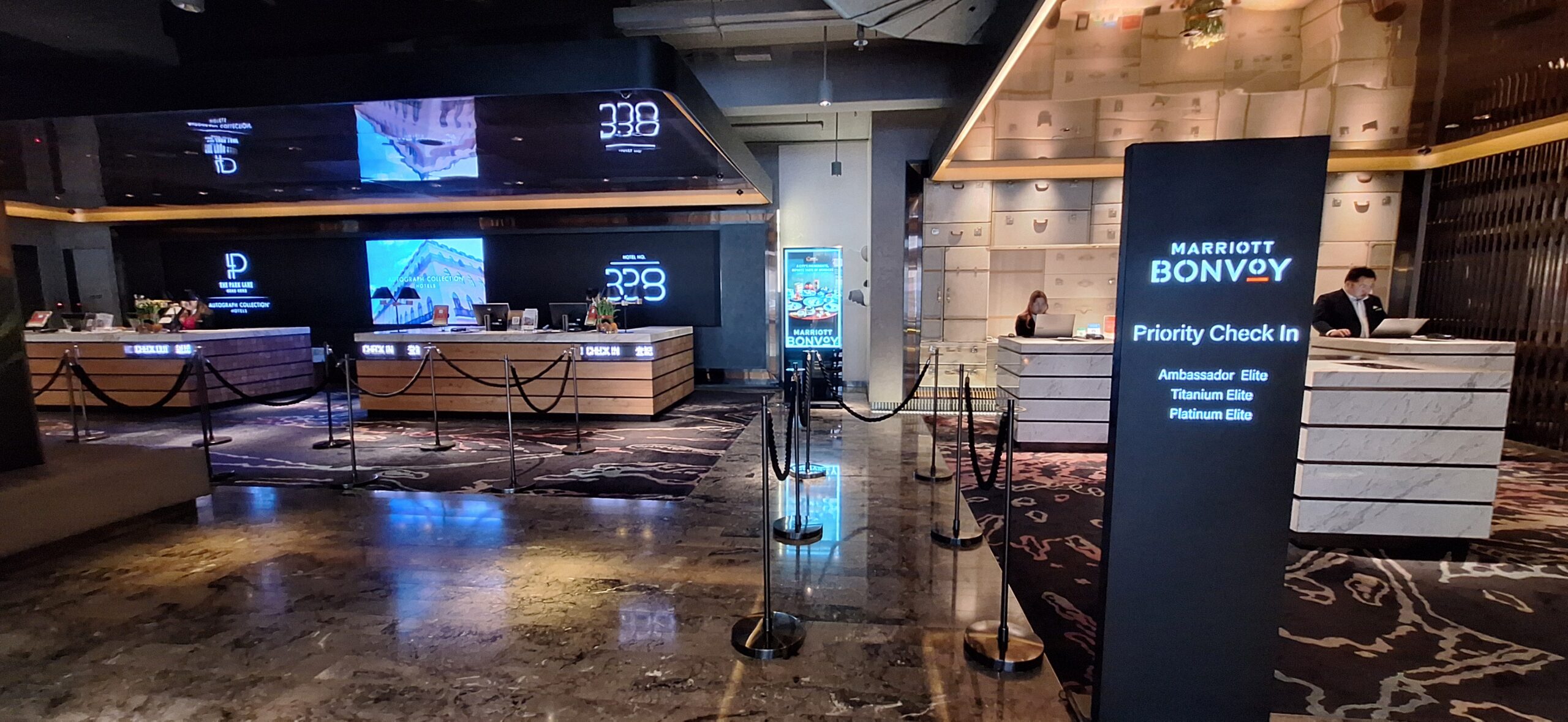 The Park Lane Hong Kong Review a room with a reception desk and a counter