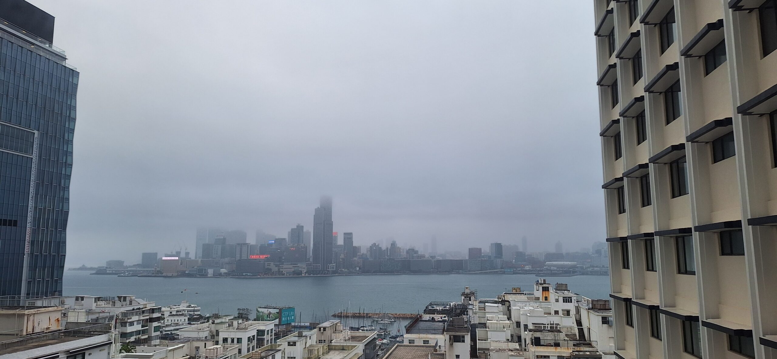 The Park Lane Hong Kong Review a city skyline with water and fog