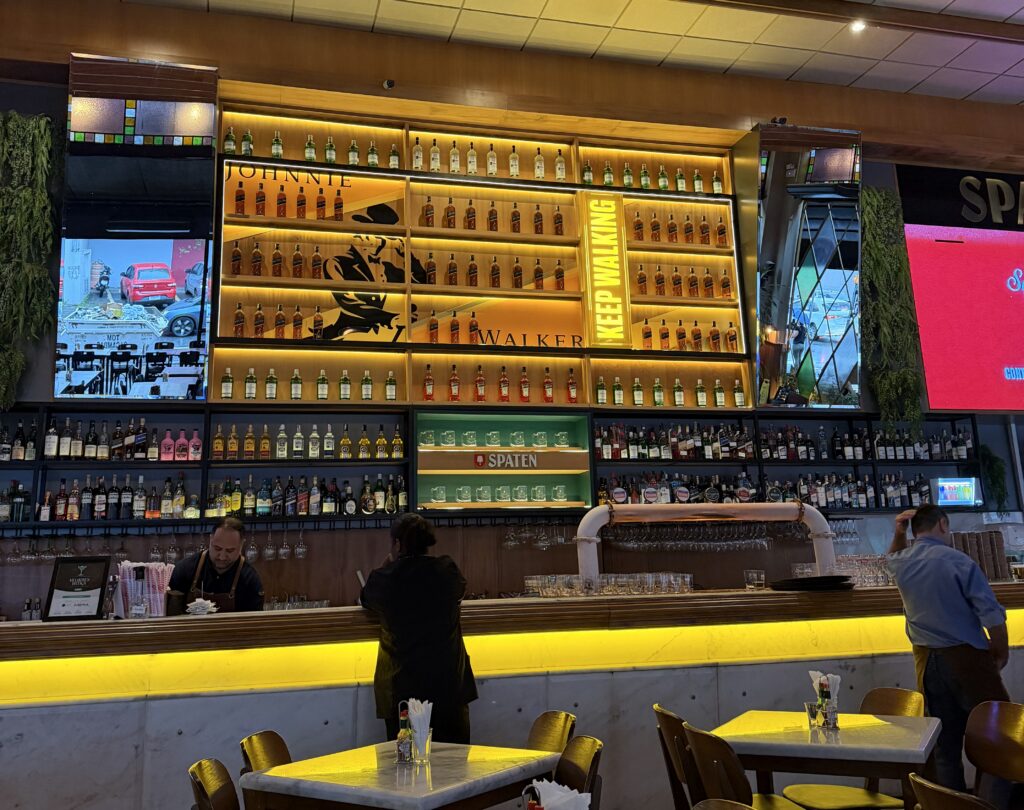 a bar with many bottles of alcohol