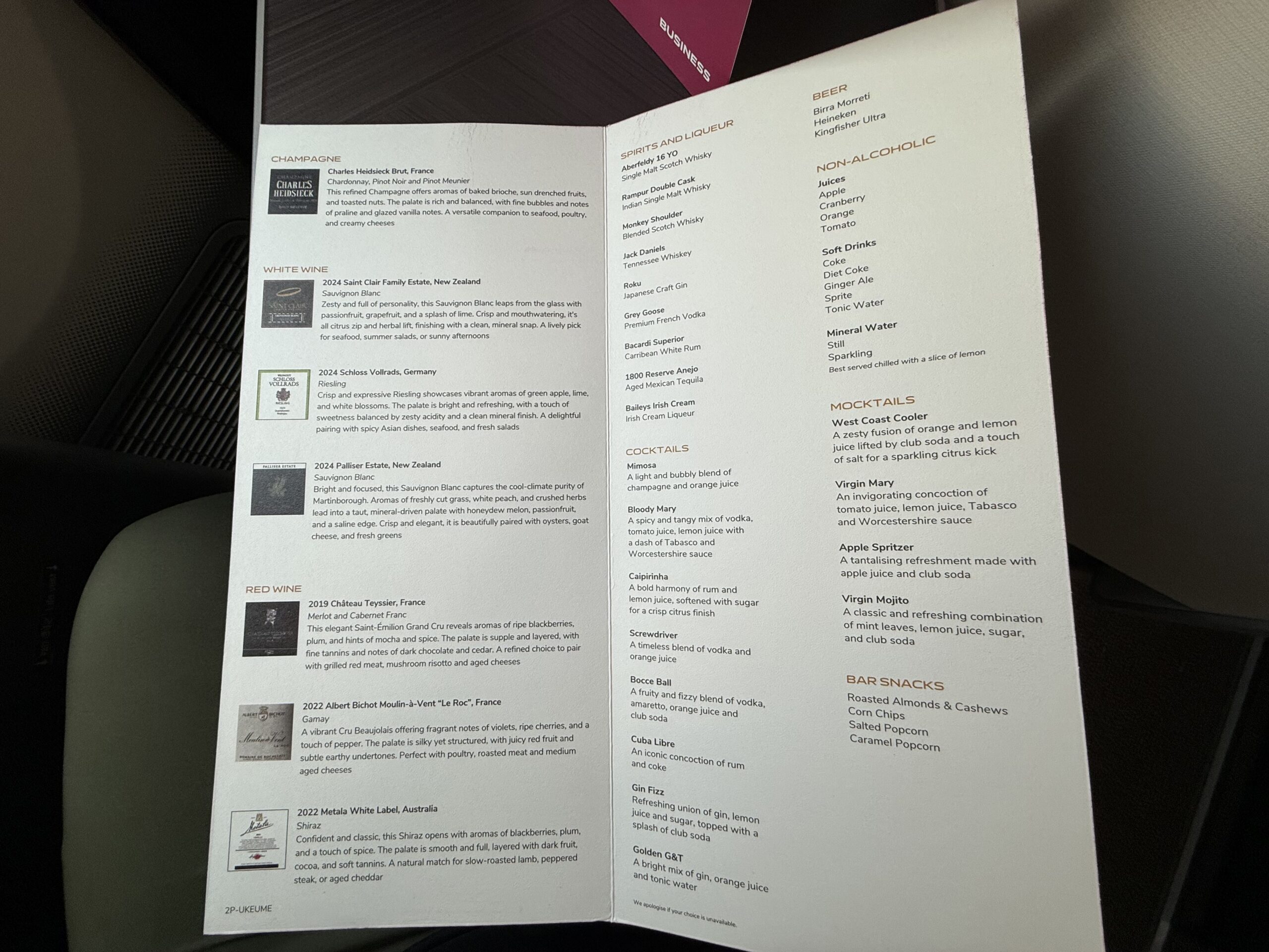 Air India 787-9 Business Class a menu with writing on it
