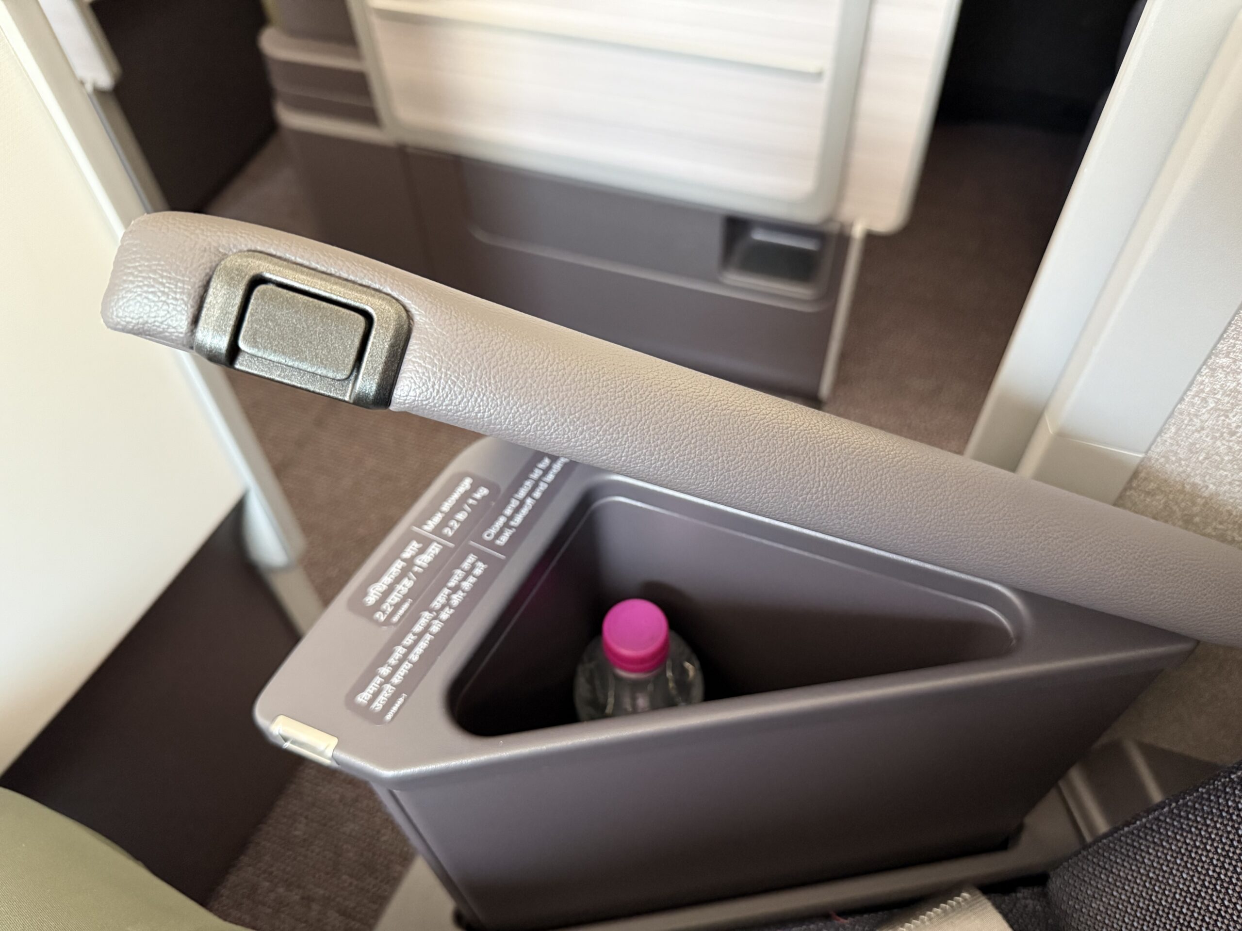 Air India 787-9 Business Class a bottle in a drink holder