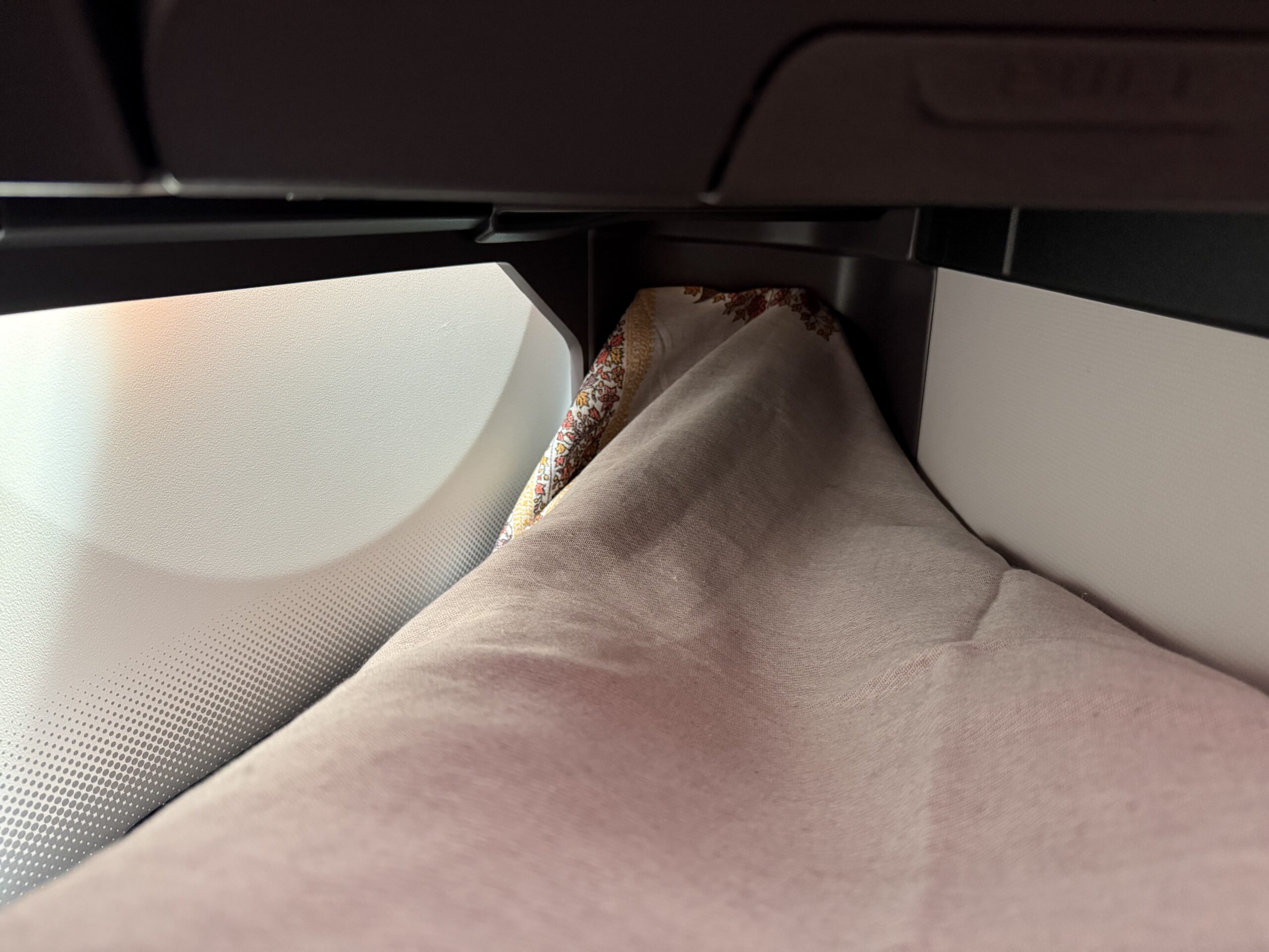 Air India 787-9 Business Class a blanket on a seat