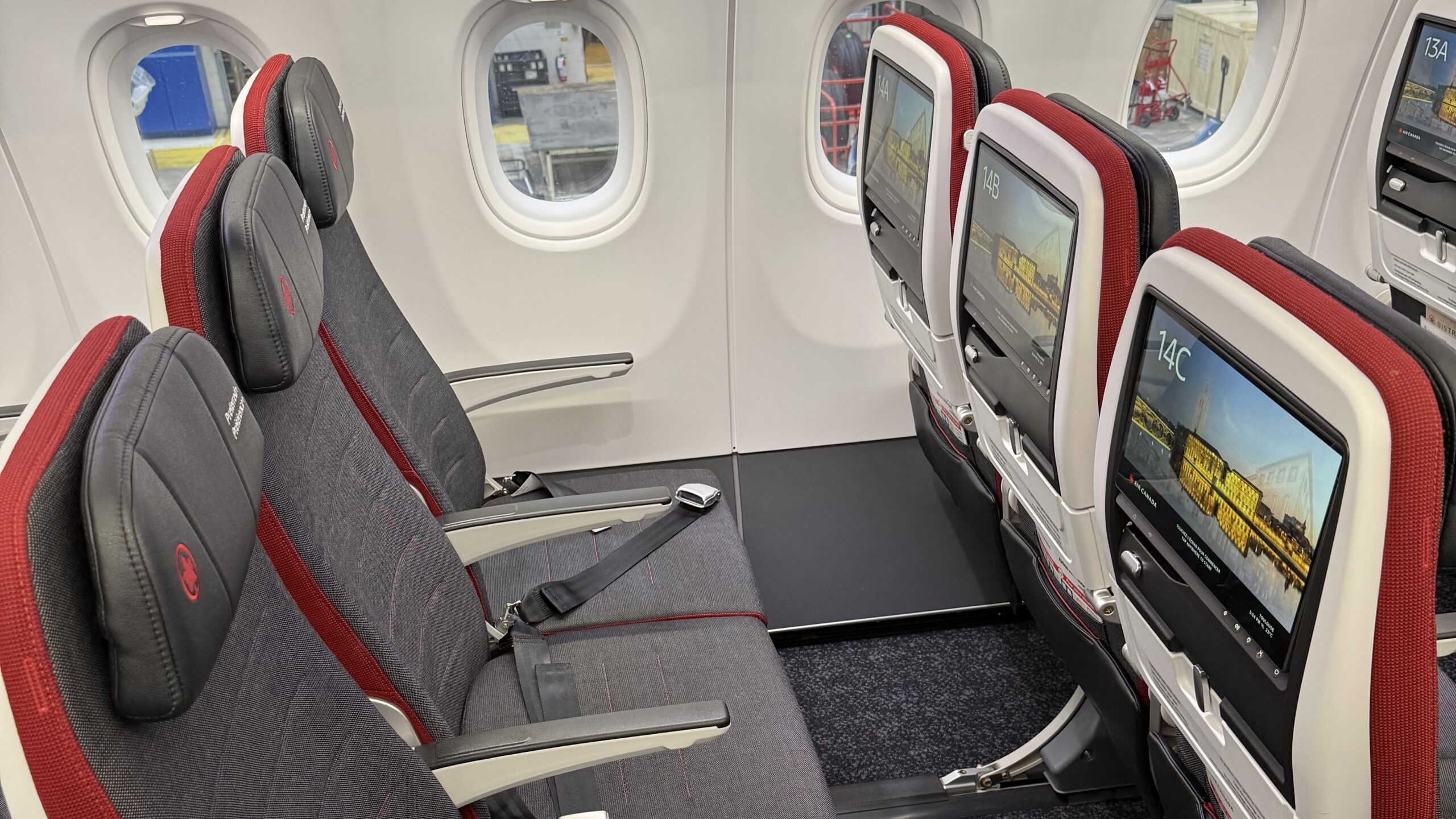 seats in an airplane with windows and seats