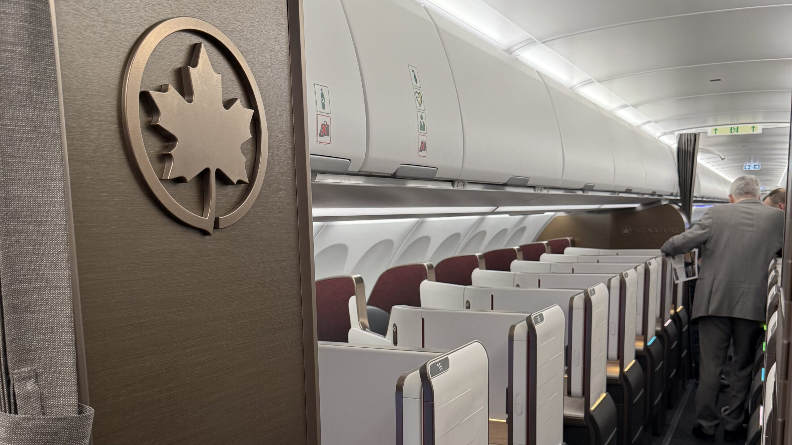an airplane with seats and a logo on the wall