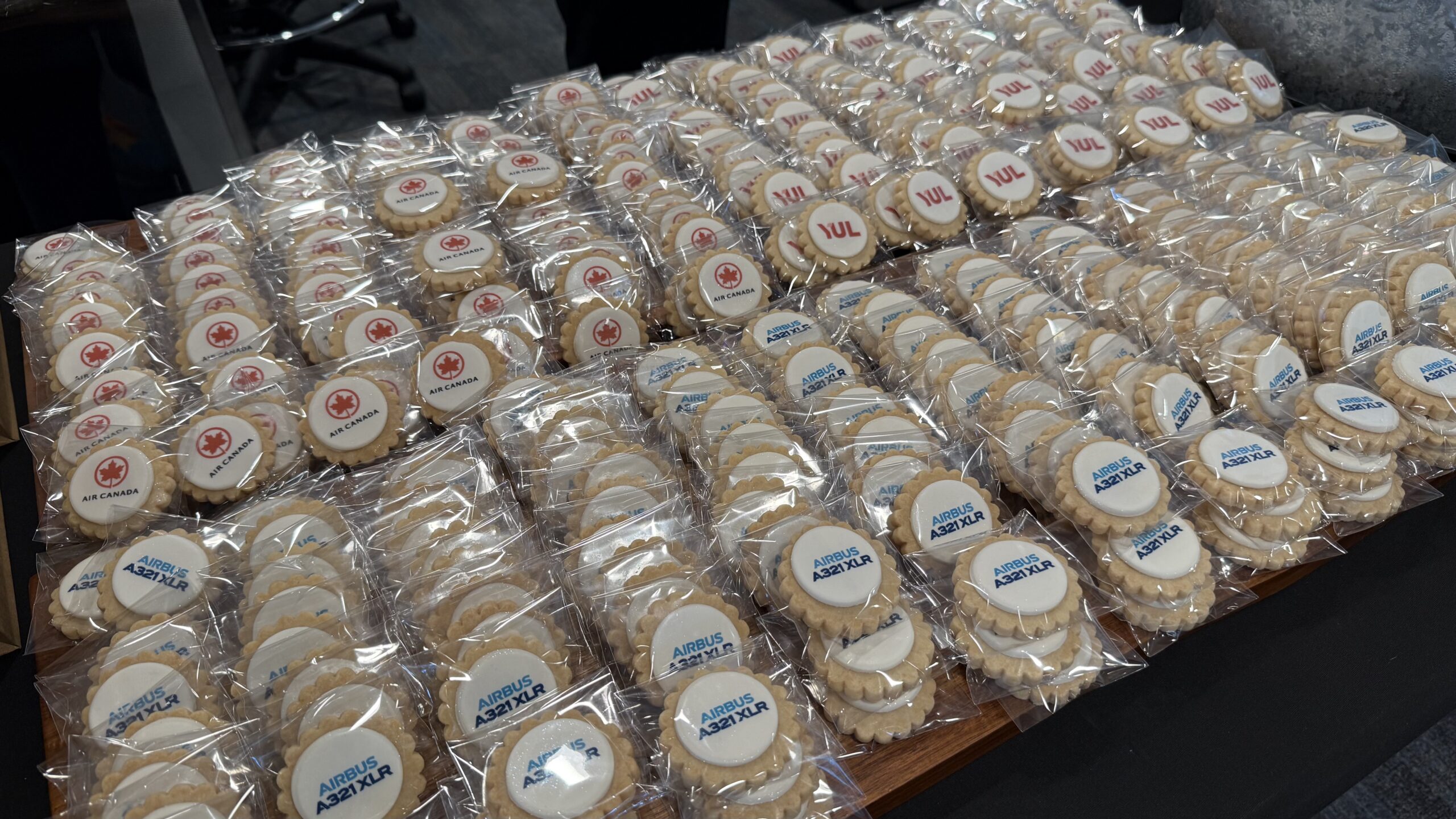 Inaugural Air Canada A321XLR a group of cookies in plastic wrap
