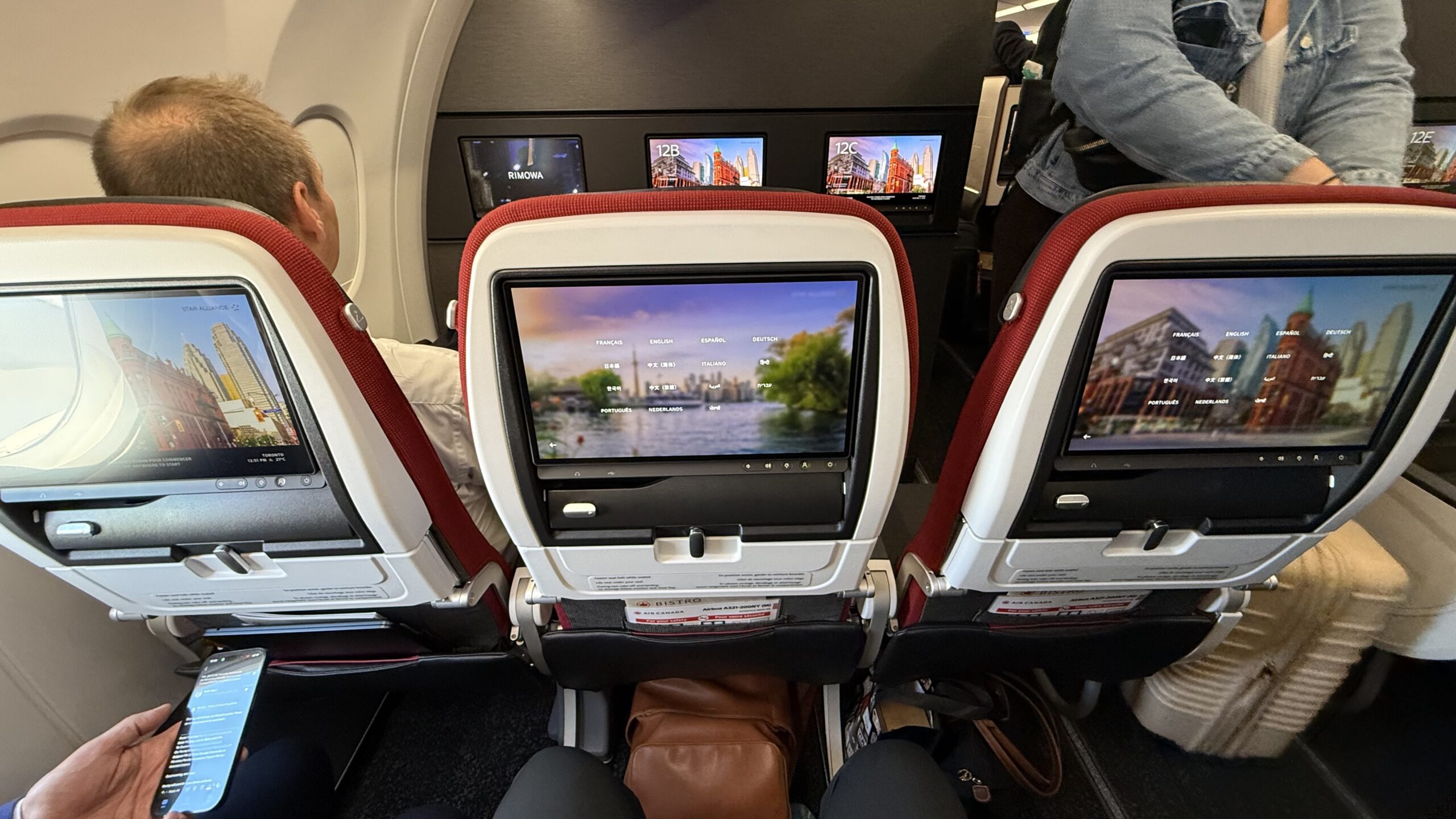 Inaugural Air Canada A321XLR a tv screen in an airplane