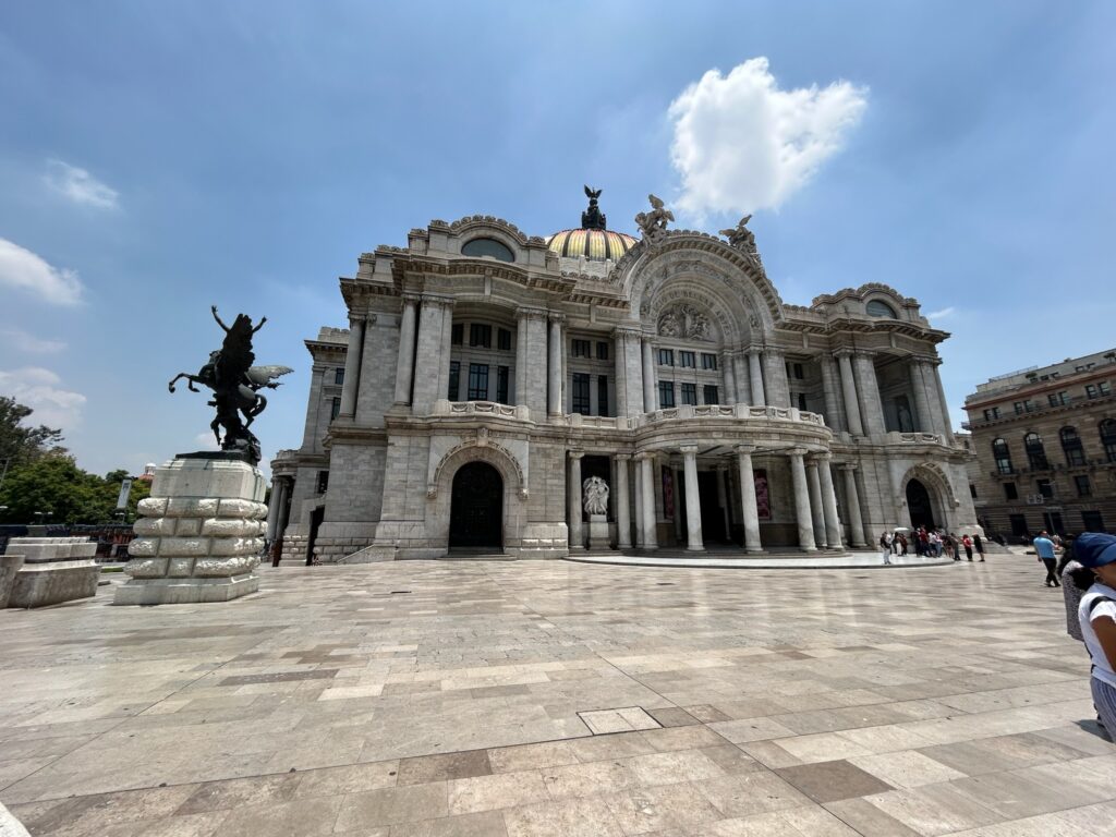 a large building with a statue in front of it