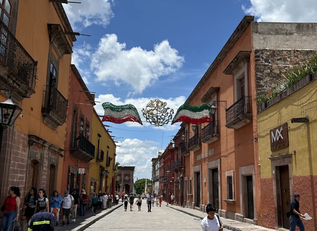 a street with buildings and people in the background