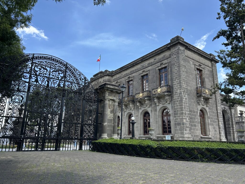 a large stone building with a gate