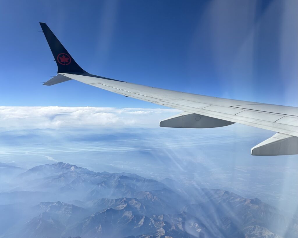 the wing of an airplane above the clouds