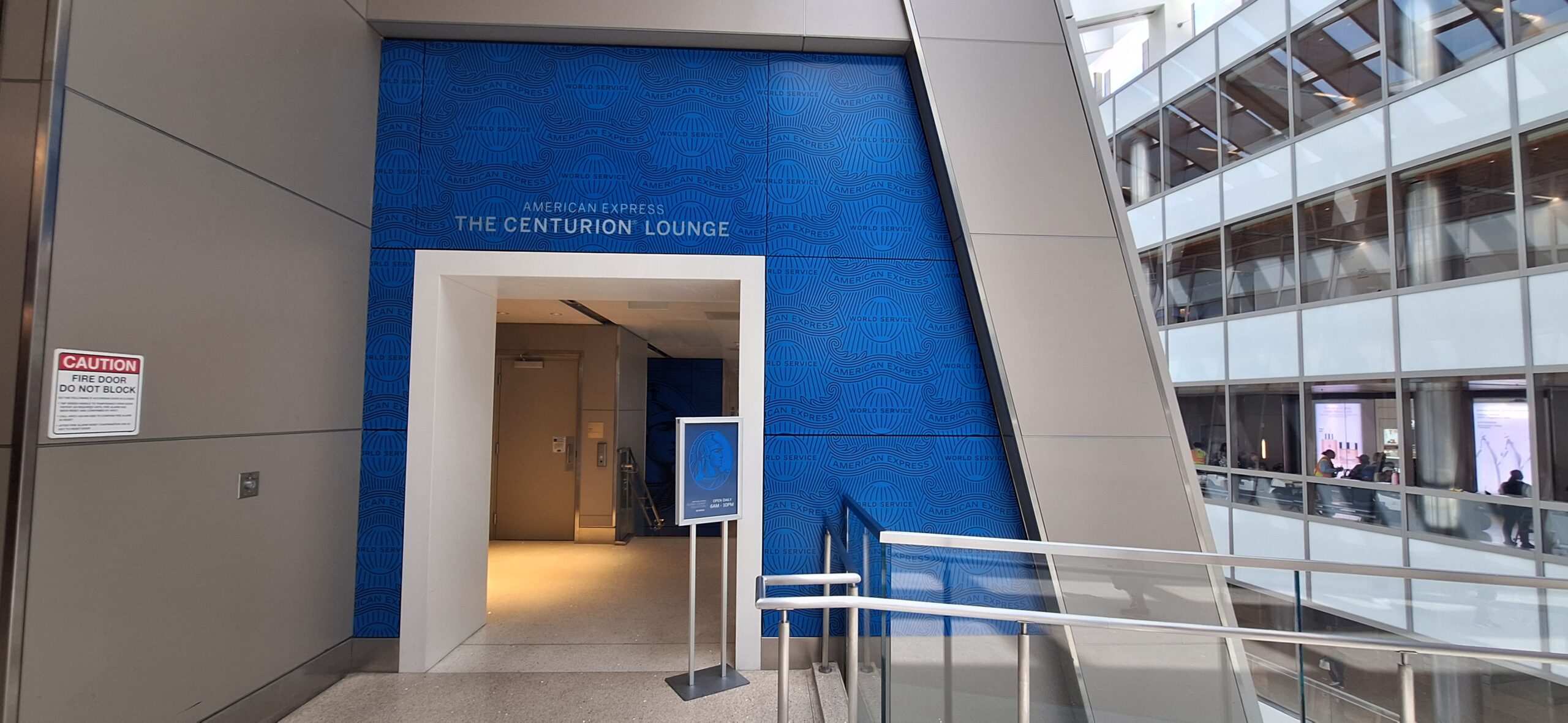 a blue wall with a sign on it