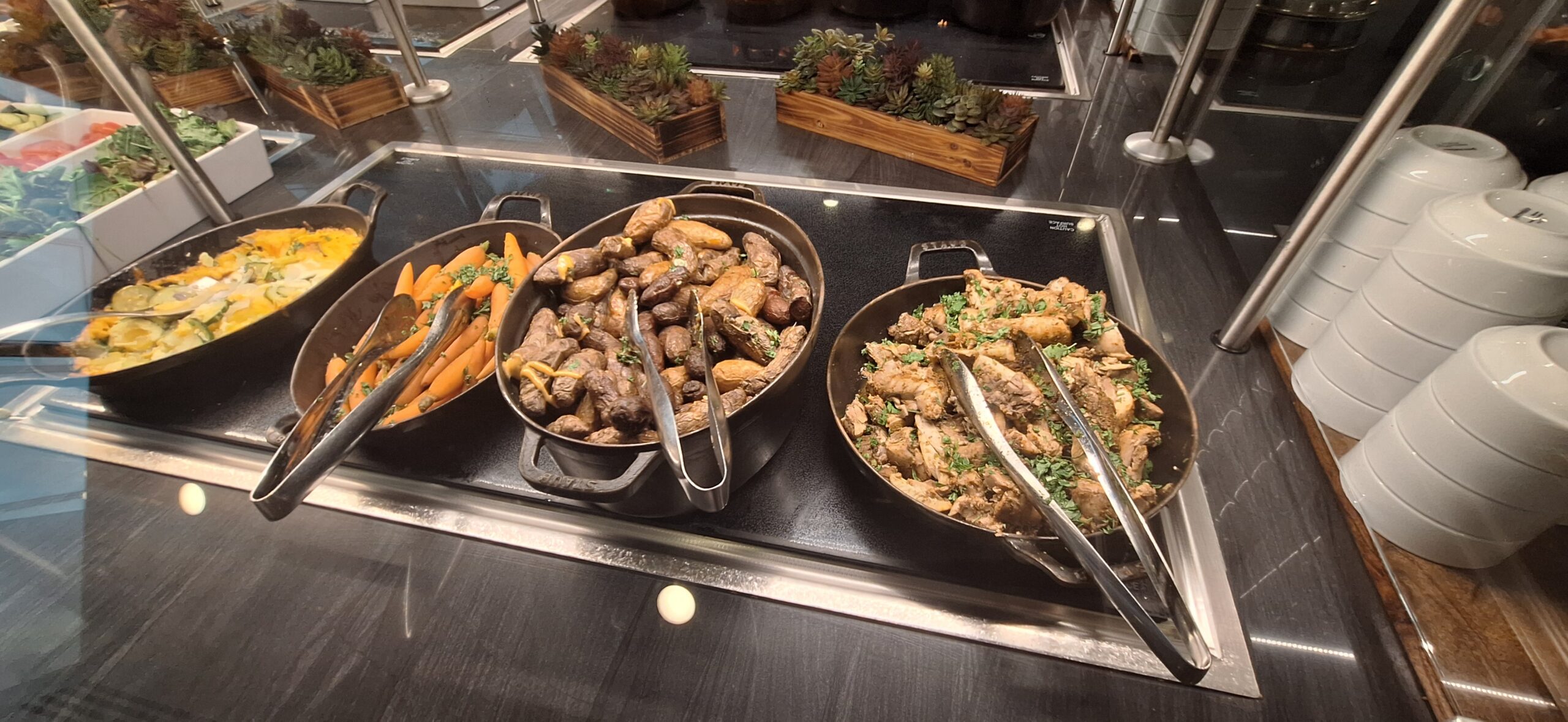 a group of pans with food in them