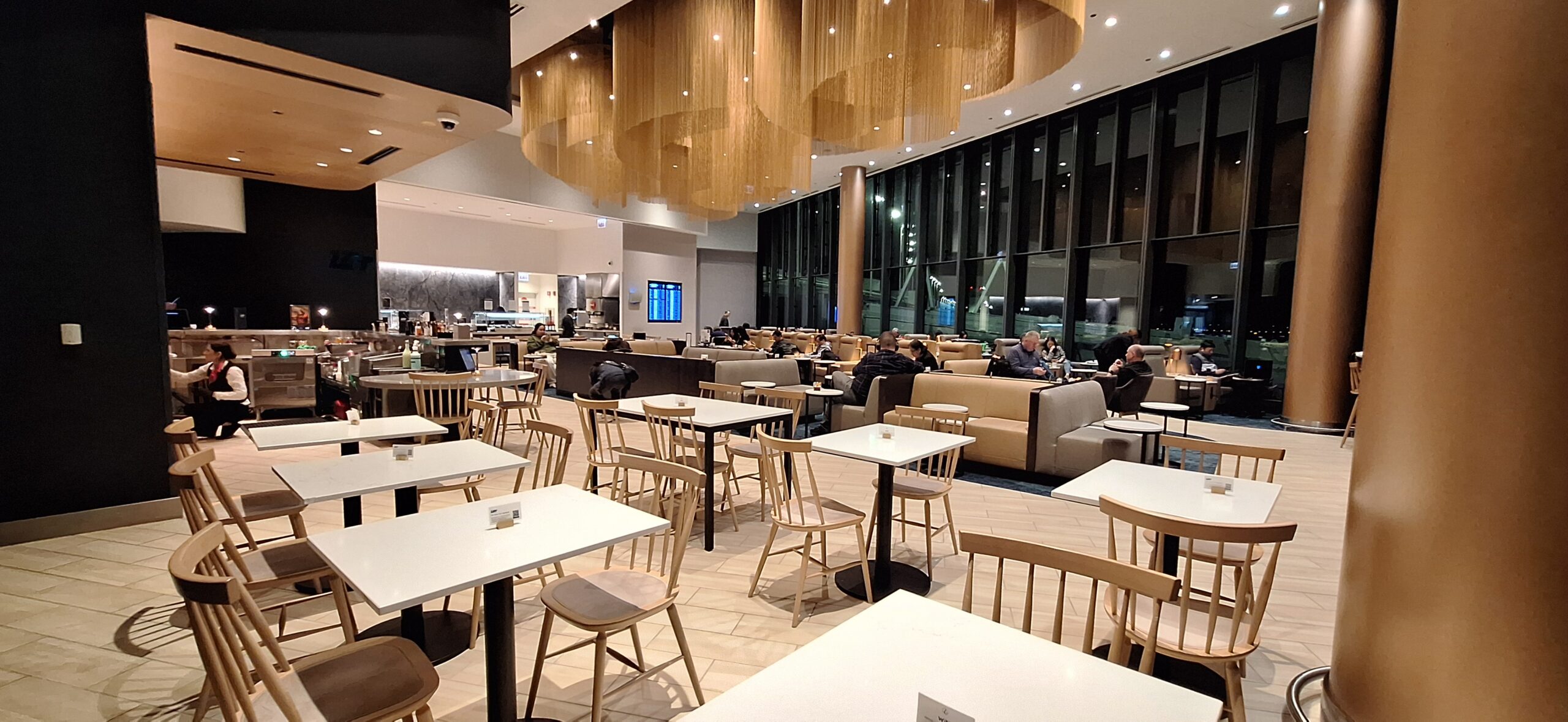 LOT Business Lounge ORD a room with tables and chairs
