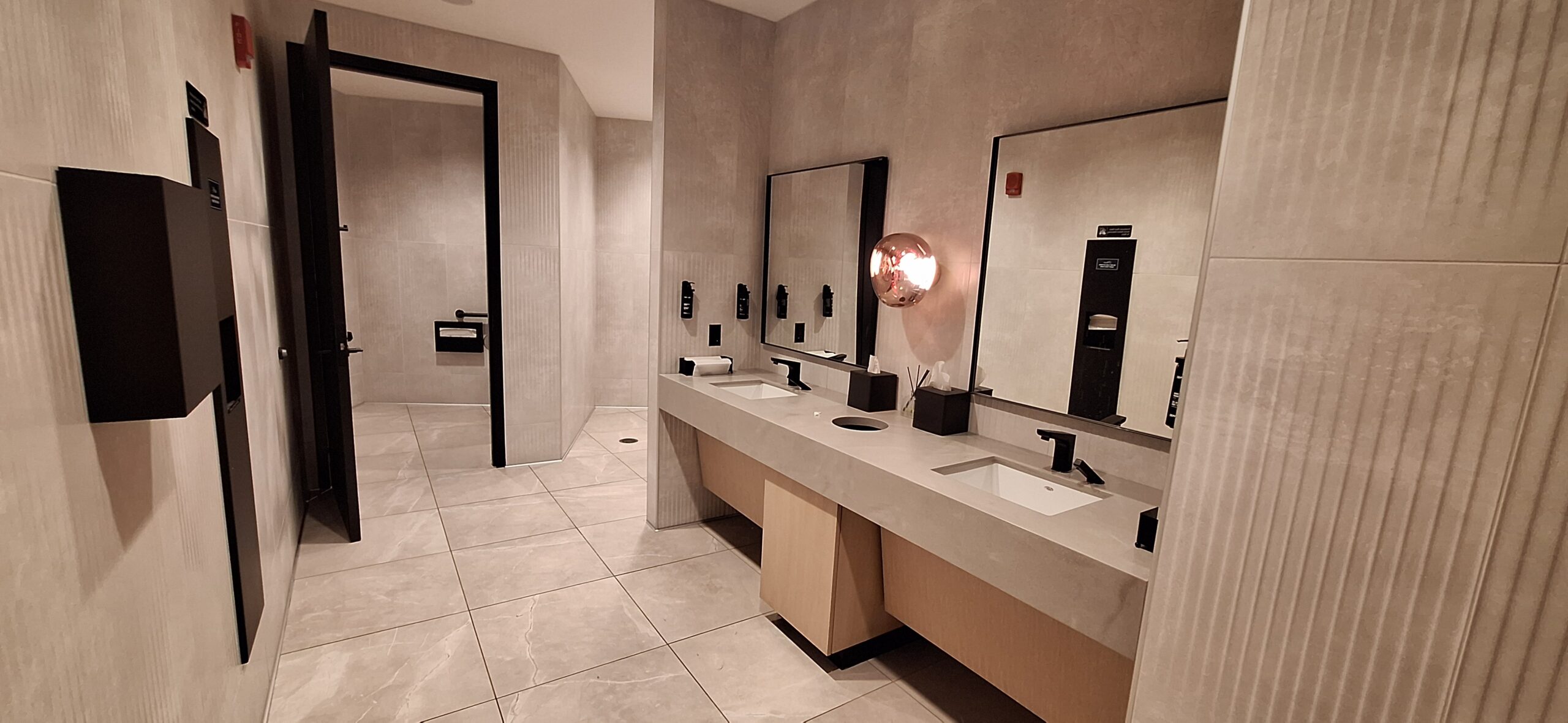 LOT Business Lounge ORD a bathroom with sinks and mirrors