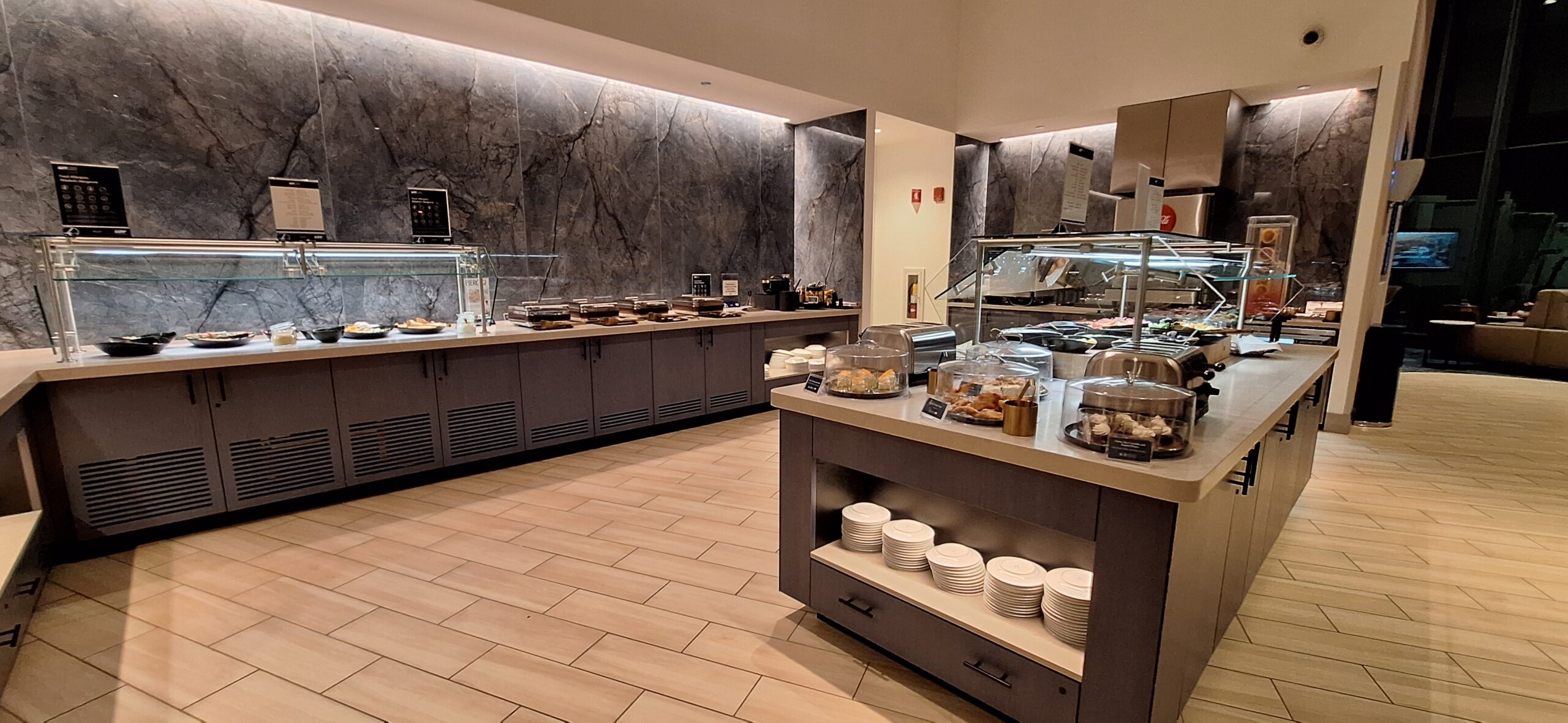 LOT Business Lounge ORD a buffet area with food on the counter
