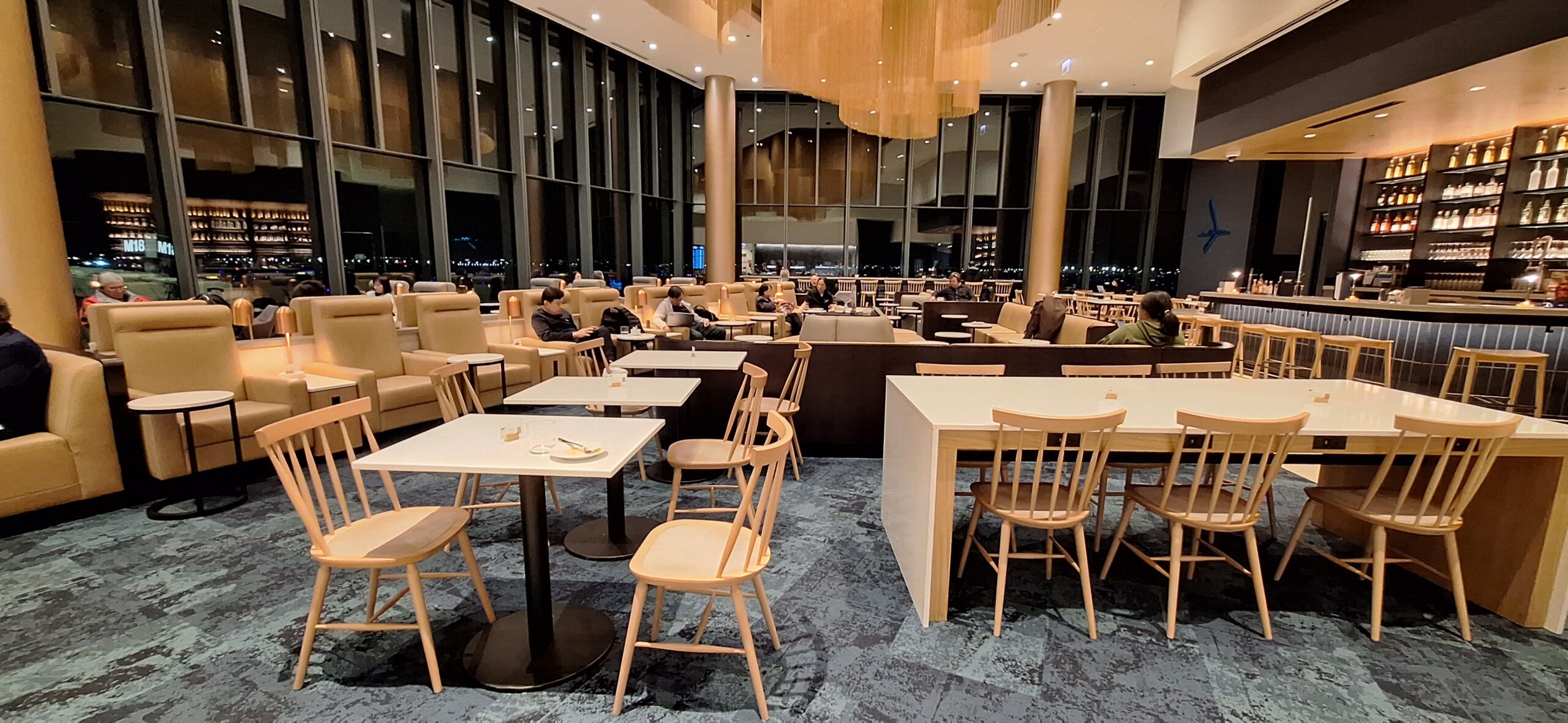 LOT Business Lounge ORD a room with tables and chairs