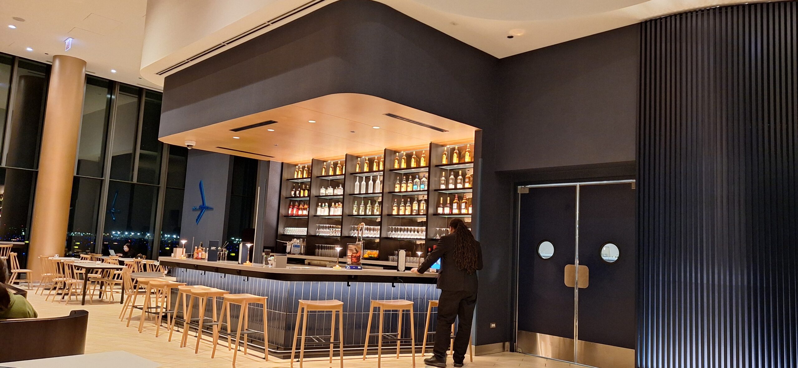 LOT Business Lounge ORD a person standing at a bar