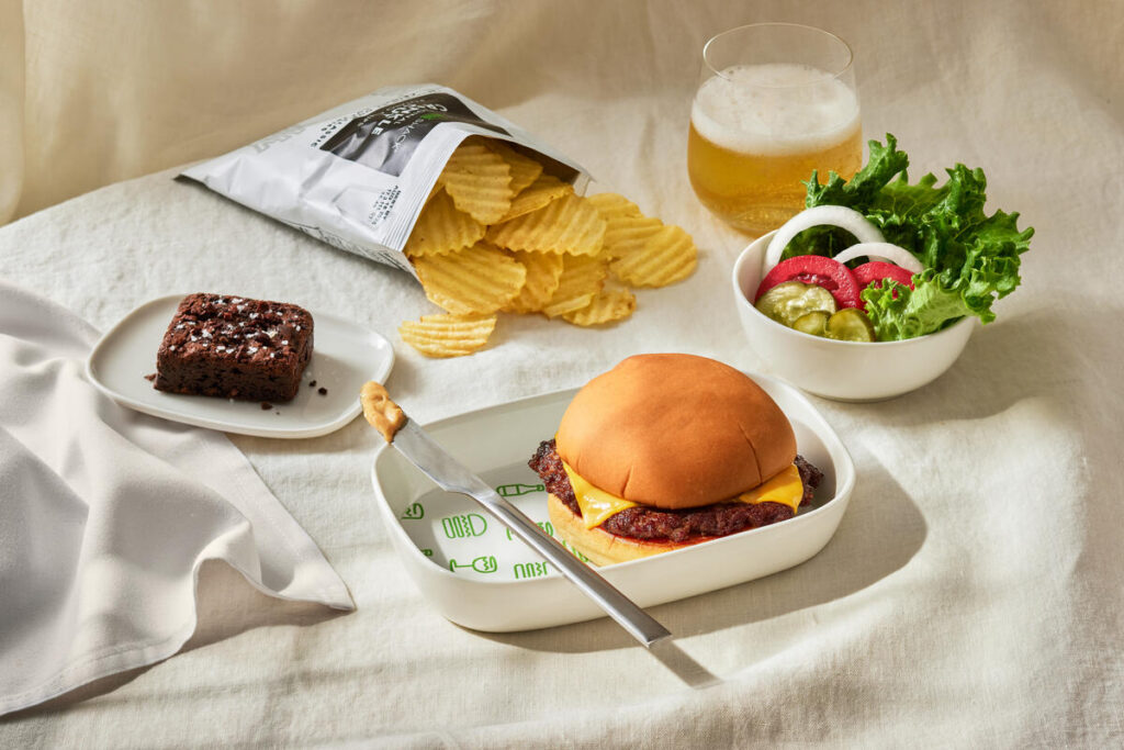 a plate of food and a drink on a table