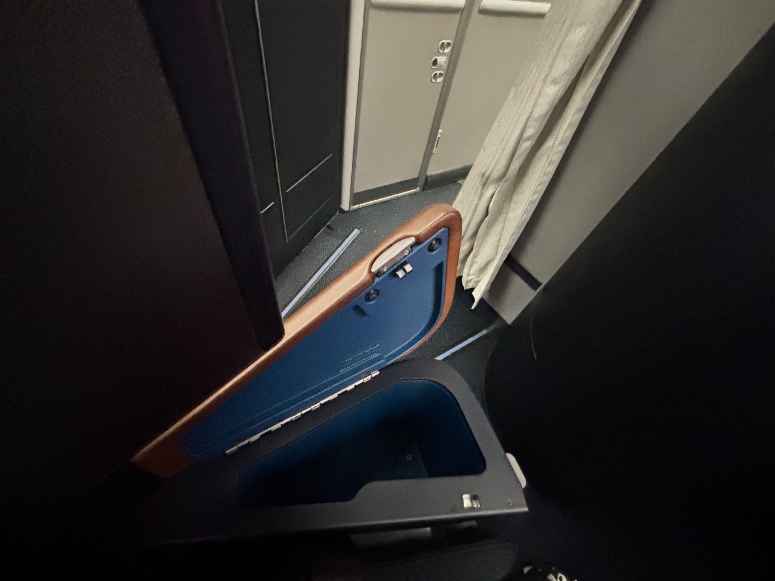 Left armrest storage