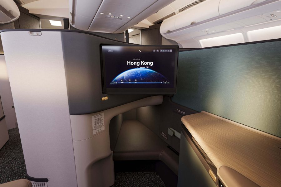 Front view of Cathay Pacific's Business class Aria Suite inflight entertainment screen and extended leg rest.